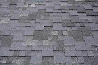 Closeup view on Asphalt Roofing Shingles Background. Roof Shingles - Roofing.