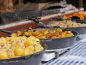 Cooking and frying potatoes and vegetable dishes.