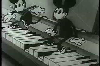 Wide shot mice playing many pianos