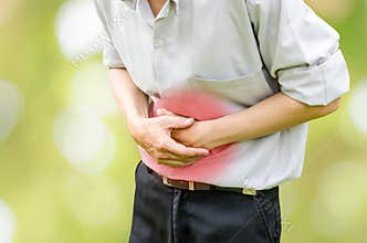 Man suffering from stomach ache because he has diarrhea