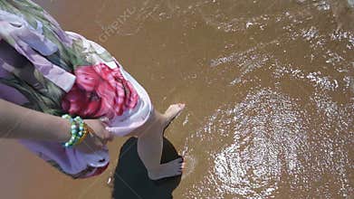 Woman trying warm water.