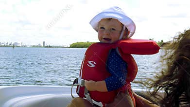 Cute baby's first time on a boat, 4K