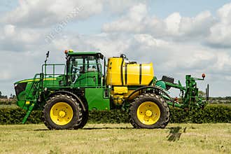 John Deere spraying in bean field