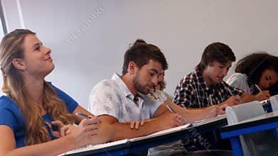 Students taking notes in class