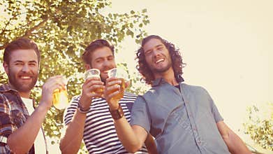 In high quality format hipster friends having a beer together