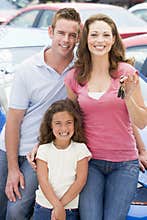 Young family collecting new car