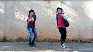 Young people dancing on the street breakdance style