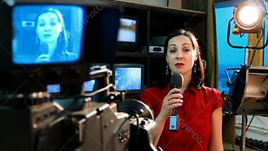 Real TV news reporter in front of the video camera