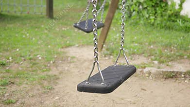 Empty Swings Swinging