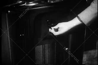 Medium shot of a person tuning radio