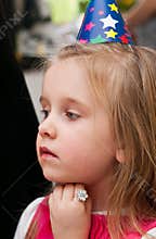 Young girl at birthday party