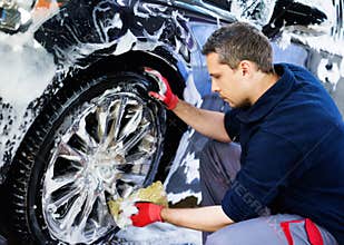 Man worker on a car wash
