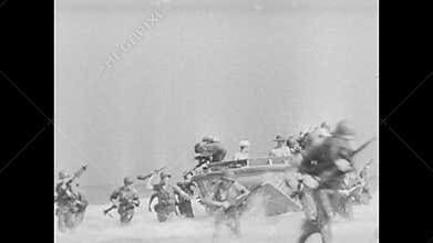 Soldiers jumping off boat and running towards shore