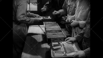 Soldiers getting utensils in mess hall, 1950s
