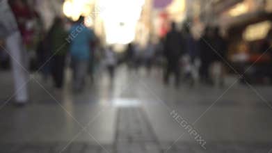 Anonymous crowded people walking on the street.