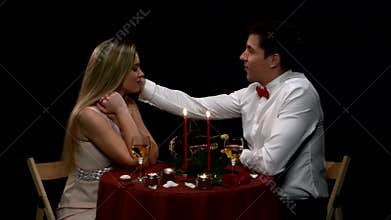 Lovely young couple having romantic evening. Close
