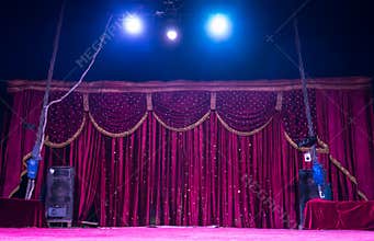 Colorful magenta curtains on a stage with spots
