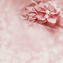Beautiful pink background with fabric flower