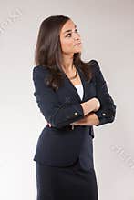 Young happy business woman with cross hands.