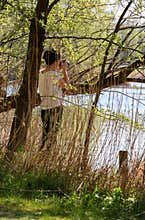 Woman photographing nature, springtime