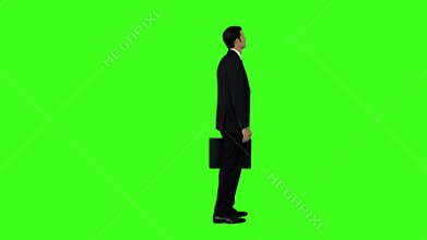 Businessman standing with his briefcase