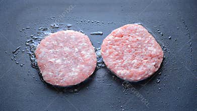 Burger Patty Sizzling On A Grill
