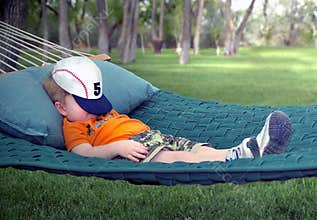 Boy sleeping in hammock