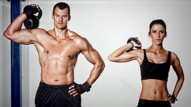 Crossfit kettlebell fitness training man and woman