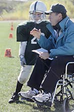 Disabled coach and junior football player
