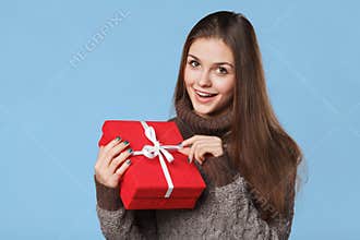 Happy smiling girl in excitement with Christmas box. Christmas Gift