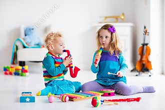 Boy and girl playing flute