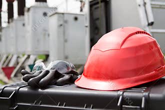 Hard hat,safety glasses and gloves on tool box.Safety gear kit close up,safety equipment for work outdoor