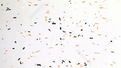 Multicolored Confetti Falling on White Wall