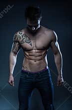 Male fitness model with the tattoo