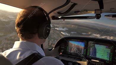 Private Plane Pilot Navigating and Flying Into Sunset