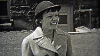 1937: Women wearing fashion hats like bollers.