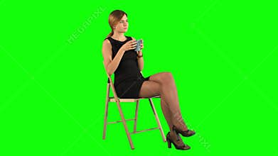 A young attractive woman with a cup of coffee or