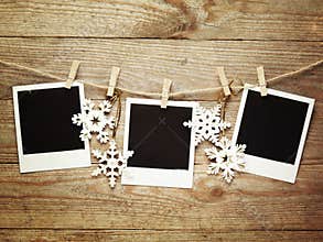 Vintage photo frames decorated for Christmas on the wooden board background with space for your text