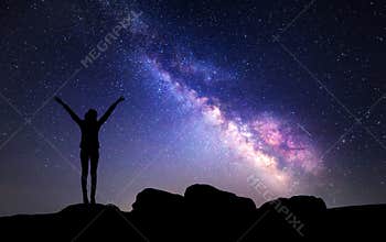 Milky Way. Night sky with stars and silhouette of a woman