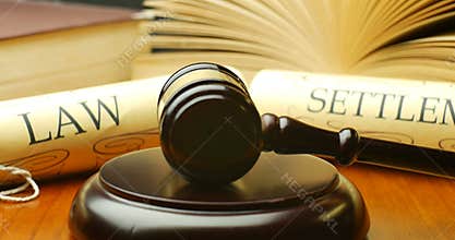 Law settlement justice litigation concept with gavel and hammer