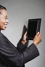Business woman holding an award