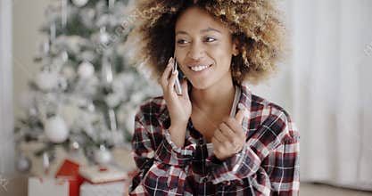 Attractive African girl chatting on her mobile