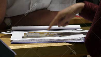 Discussing house drawing