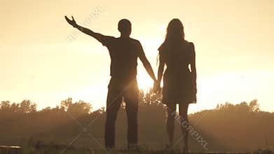 Lovers rejoice rain at sunset