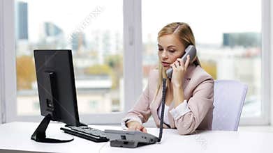 Angry businesswoman with computer and telephone
