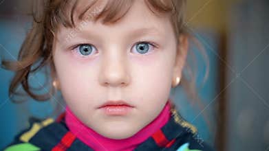 Portrait of a child who looks into the camera