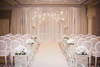 Beautiful wedding ceremony design decoration elements with arch, floral design, flowers, chairs