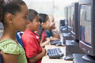 Kindergarten children learning to use computers