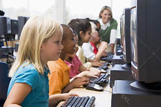 Kindergarten children learning to use computers