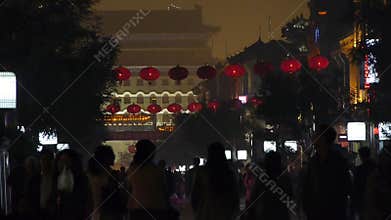 Crowd walk on Chinatown,China Beijing night market,memorial arch & lantern.